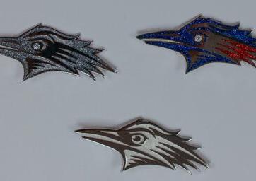 Various brooches featuring MSU Denver's Roadrunner logo.